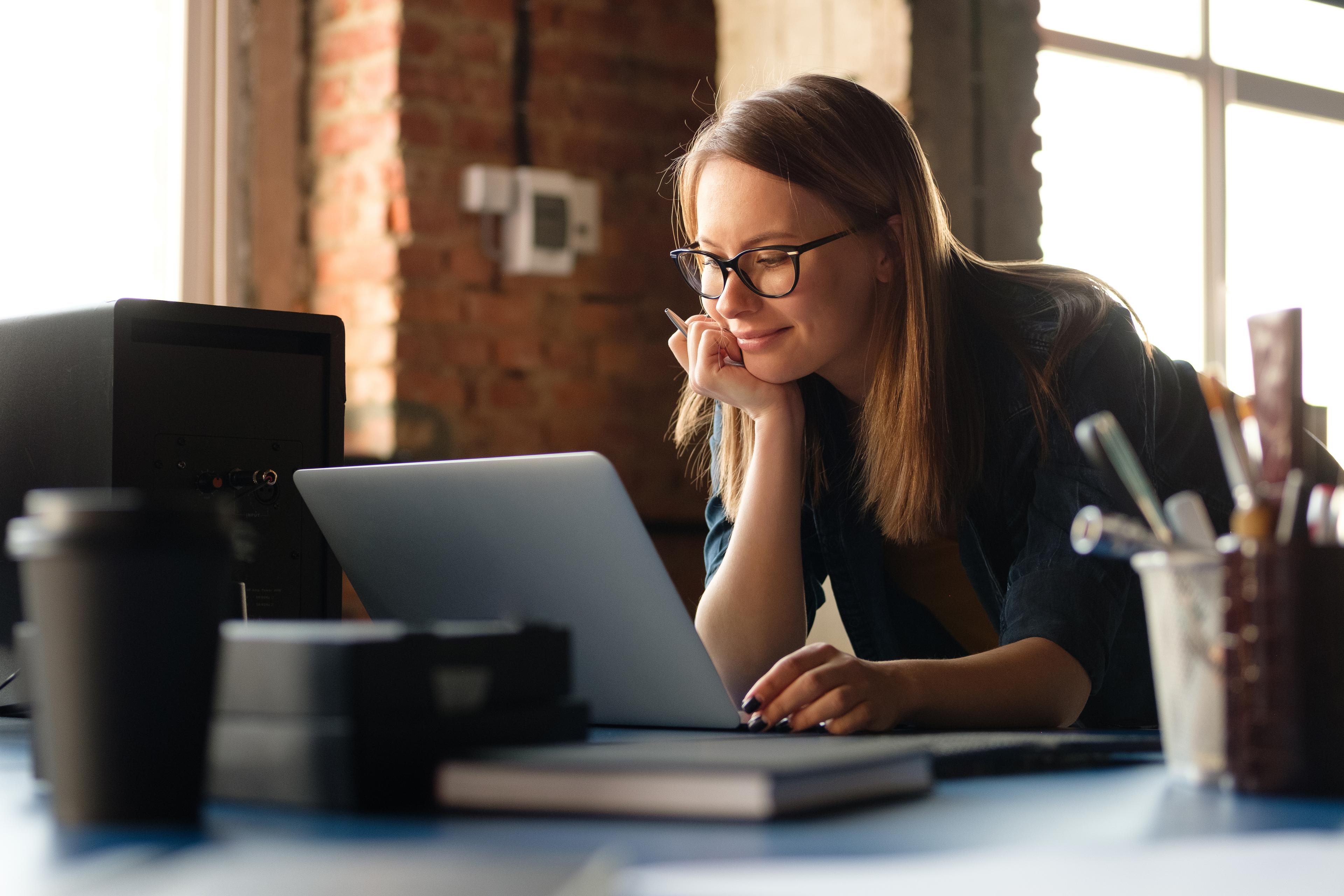 woman looking at laptop